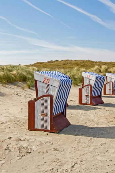 View of beach chairs in the dunes of Noederney, island in East Frisia.